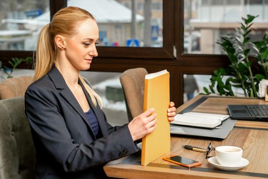 Businesswoman with folder with documents