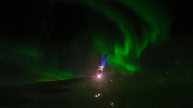 Vancouver Canada October 2019, view from an airplane Iceland Air window at the Northern light Aurora