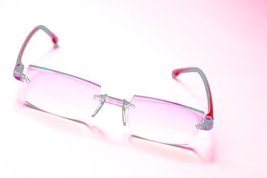 Neon pink red eyeglasses to improve vision disco. isolated