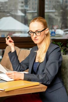 Young businesswoman working with documents