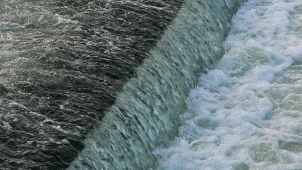 Close-up view of the water dam on the river.