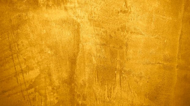 Texture of golden decorative plaster or concrete. Abstract grunge background for design