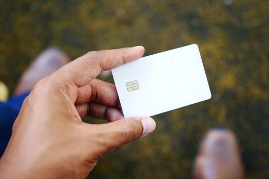 close up of person hand holding credit card