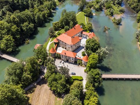 Romantic Otocec Castle on Krka River in Slovenia. Drone View.