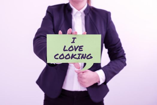 Conceptual caption I Love Cooking. Business approach Having affection for culinary arts prepare foods and desserts Lady in suit holding pen symbolizing successful teamwork accomplishments.