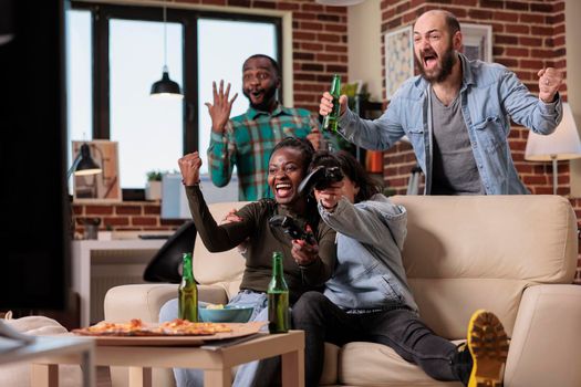 Diverse group of friends celebrating video games win together