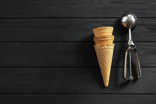 top view, wafer cups for ice-cream on dark wooden table