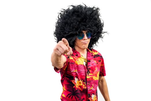 Self assured man in Afro wig pointing at camera