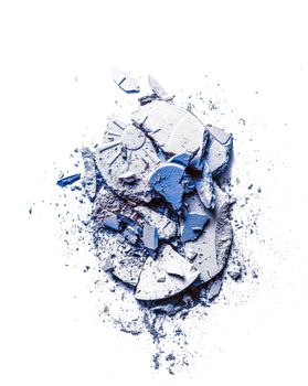 Crushed eyeshadows and powder isolated on white background