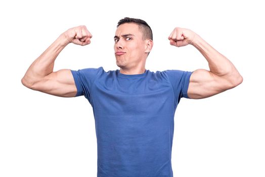 Man gesturing to be strong raising the biceps