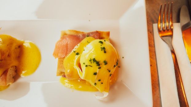 Poached egg with salmon for brunch in a luxury restaurant