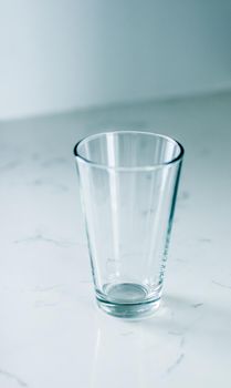 Clean empty glass on marble table