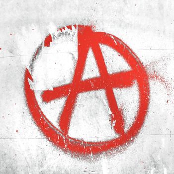 Red anarchy symbol on wall. Ideal for textures, backgrounds and concepts.