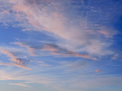 Evening sky, amazing with Colorful Sunset and majestic Sunlight on Twilight ,purple,pink and Blue Nature Dusk Sky Background.Abstract pattern of cirrus clouds in sunset sky. Atmospheric phenomenon