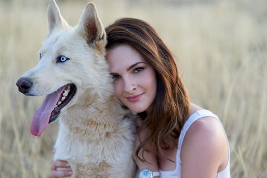 Hes a true and loyal friend. Portrait of an attractive young woman bonding with her dog outdoors.