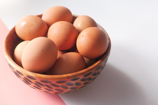 close up of eggs in a bowl.