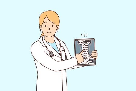 Smiling female doctor show body organ on tablet