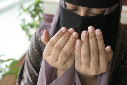 Close up of muslim women hand praying at ramadan