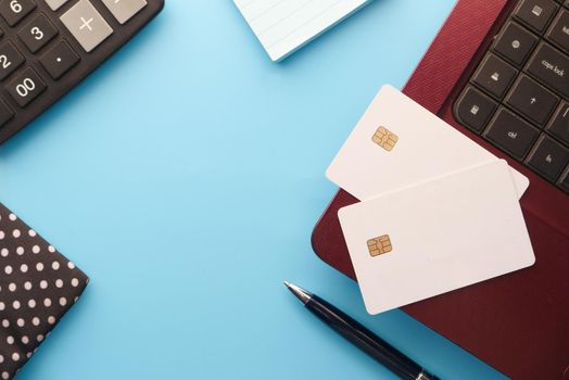 high angle view of credit cards on laptop on white background