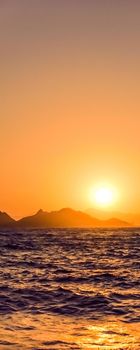 Summer sunset at the Mediterranean sea coast, seascape and mountain view