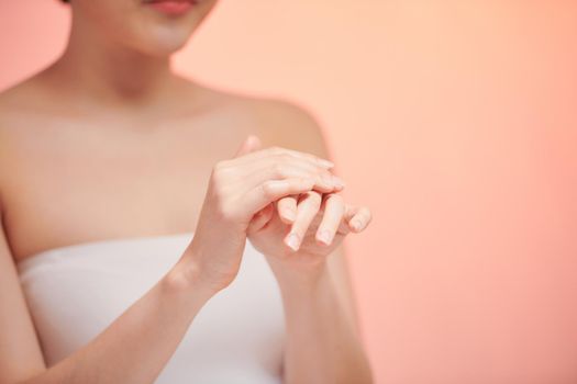 Beautiful women hands isolate, applying cream, massaging