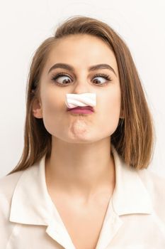 Woman with candy marshmallow-like mustache