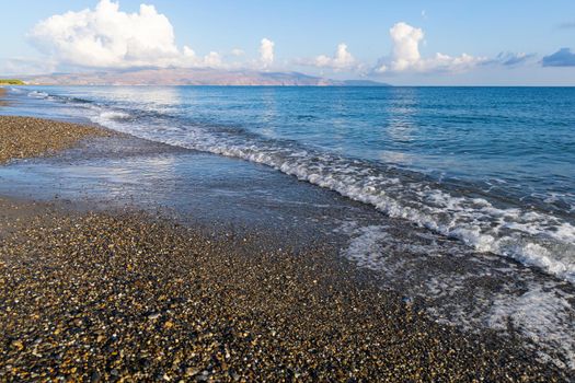 Sea shore. Beautiful empty beach in summer sunny day on Crete island in Greece.