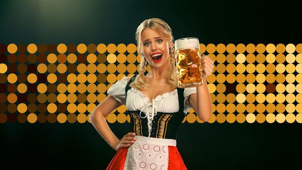 Beer for Oktoberfest from sexy girl in traditional german dirndl. Photography for advertising design at Oktoberfest 2022
