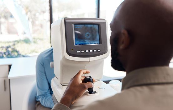 Eye exam by a doctor looking and checking the vision of a patient at a sight specialist office. Medical healthcare screen technology helping an optometrist see retina health and wellness