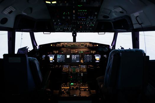 Nobody in empty captain cabin used to fly airplane with dashboard