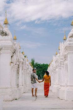Tourist among of stupas in Kuthodaw Pagoda, known as the world's largest book. Kuthodaw is a Buddhist stupa, located in Mandalay, Burma Myanmar