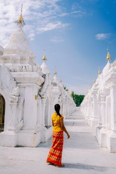 Tourist among of stupas in Kuthodaw Pagoda, known as the world's largest book. Kuthodaw is a Buddhist stupa, located in Mandalay, Burma Myanmar
