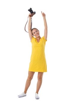 Woman photographer with arms raised