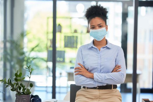 Covid mask policy and safety in the office workplace with businesswoman covering her face during quarantine, lockdown or flu season. Respectful and leadership professional female in a work portrait