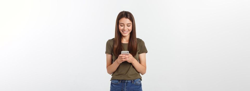 Laughing woman talking and texting on the phone isolated on a white background.