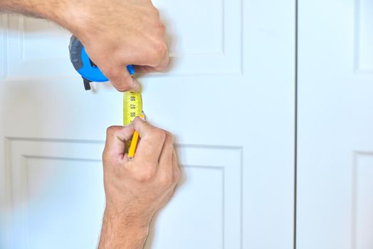 Installation of new cabinet, handyman plans place of fastening door handles