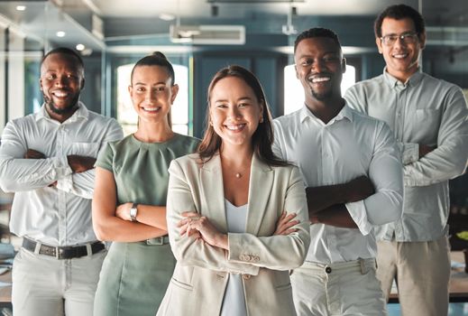 Portrait of team, posing in the office in a business meeting and smiling. Professional ceo, management and employees showing good teamwork with diverse, young and multiracial workers.