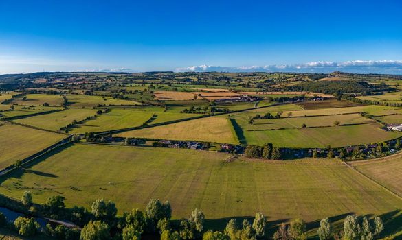 Aerial panoramic view over North Yorkshire countryside surrounding the village of Pool in Wharfedale and the River Wharfe.