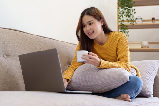 woman drinking coffee after taking a break from using the computer