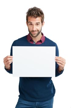 This is something everyone will be talking about. Studio portrait of a handsome man holding a blank placard against a white background.