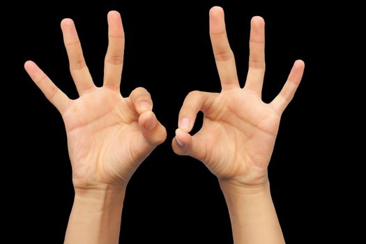Close up shot of pair of extended male hands doing demonstrating chin mudra or mudra of consciousness isolated on black background. Horizontal shot of chin mudra demonstration.