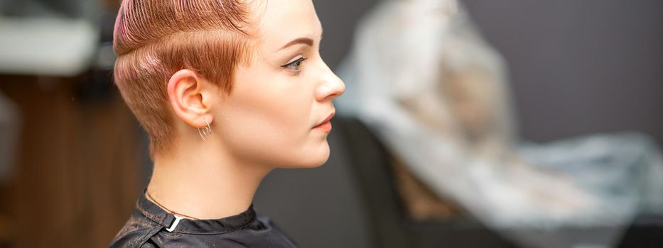 Woman with short haircut in salon