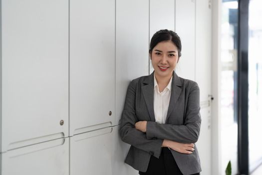 Entrepreneur young asian woman, business woman arms crossed at her office.
