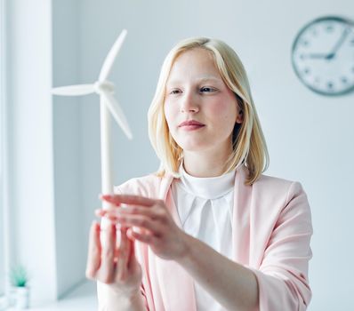 business woman portrait office businesswoman young windmill energy environment electricity power innovation model ecology renewable eco green