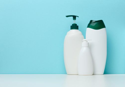 Empty plastic white bottles for cosmetics and other liquid substances 