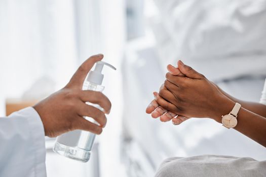 Doctor giving patient hand sanitizer for covid protection, hygiene and protocol in hospital or clinic. Healthcare safety, flu germs and cleaning hands to prevent sick, bacteria virus and health risk