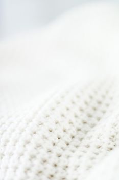 Warm knitted clothes, soft and white