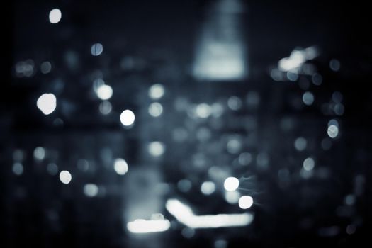 Big metropolitan city lights at night, blurry background