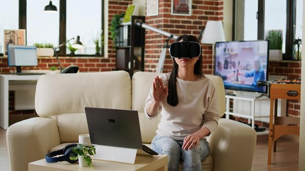 Woman wearing virtual reality headset scrolling through metaverse cyberspace