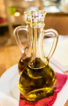 Bottles of organic extra virgin olive oil in Italian restaurant